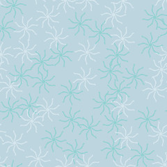 Winter seamless pattern with chaotic snowflakes in different shades of blue color