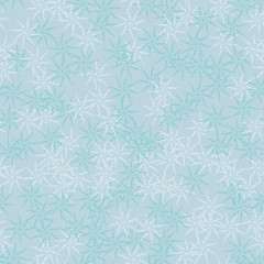 Winter seamless pattern with chaotic snowflakes in different shades of blue color