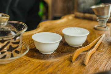 Chinese tea ceremony with Anchnag on wooden background