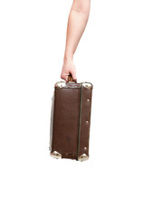 Retro suitcase and female hands isolated on the white background.