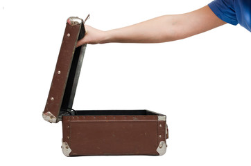 Retro suitcase and female hands isolated on the white background.