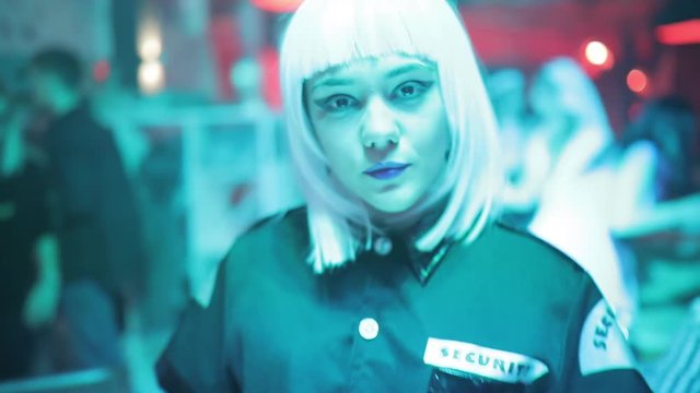 Sexy security woman in a nightclub go to me