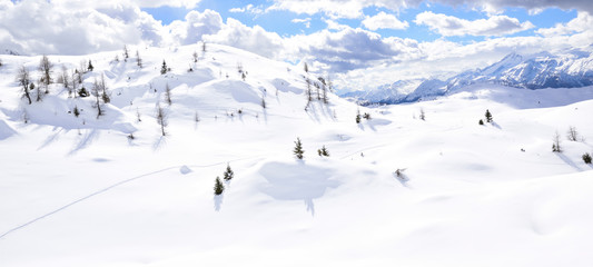 the peaks of the Alps in winter with soft snow