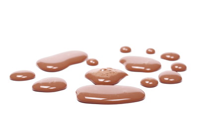 Obraz na płótnie Canvas Spilled chocolate milk puddle isolated on white background