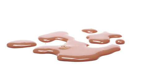 Spilled chocolate milk puddle isolated on white background