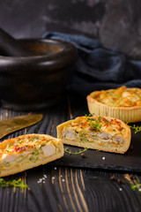 Meat mini pie on the wooden board on table background, closeup with copy space, rustic style