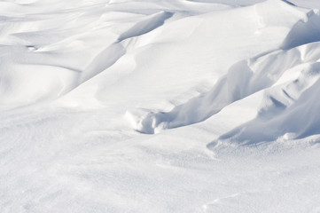 Wind sculpted patterns on snow surface.
