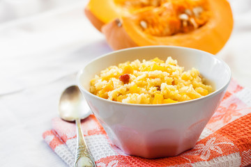 Milky cereal porridge with pumpkin and raisins