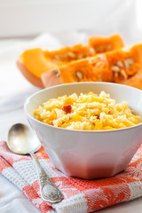 Milky cereal porridge with pumpkin and raisins