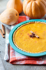 Homemade spicy pumpkin pie with cinnamon
