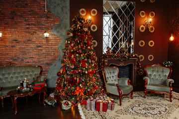 Christmas interior of the living room with red and gold colors. Room with a large Christmas tree, decorated with beautiful garlands, toys and decor. Under the tree are Packed gifts.