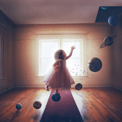 Little girl and solar system