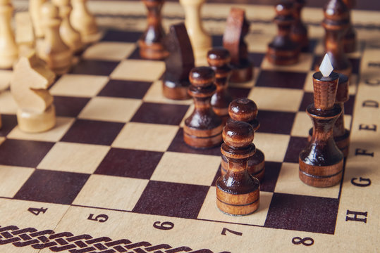 Chess game. Chess picies are standing on the board.