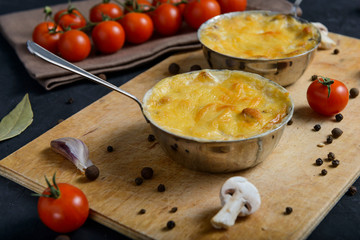 julienne with mushrooms on a wooden background