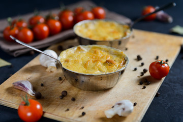 julienne with mushrooms on a wooden background