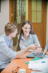 the guy with the girl at the computer, office workers