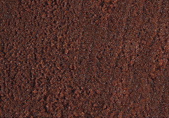 Rich dark chocolate paste texture. Sweet sugary mass.