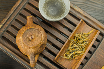 Chinese tea ceremony with Anchnag on wooden background
