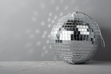 Disco ball on gray cement background