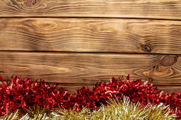 wooden background new year holiday shiny tinsel