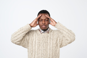 African young man, slapping hand on head having a duh moment isolated on gray background.