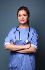 Portrait of a caucasian woman in front of blue background