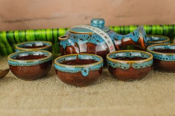 Chinese tea ceremony with Anchnag on wooden background