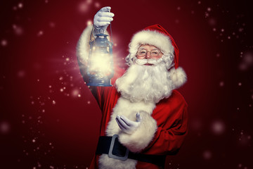 santa claus is holding lantern © Andrey Kiselev