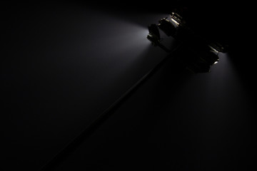 Rays of light from the searchlights of lighting mast..