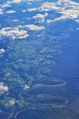 Aerial view of topographical landscapes over midwest states on flight over Colorado, Kansas, Missouri, Illinois, Indiana, Ohio and West Virginia during autumn. Grand sweeping views of crops, rivers, p