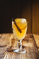 Hot white mulled wine in glass with orange