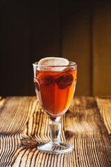 Mulled wine with cinnamon, lemon and strawberry