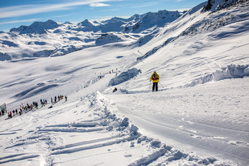 Image from afar skiers in snowy resort