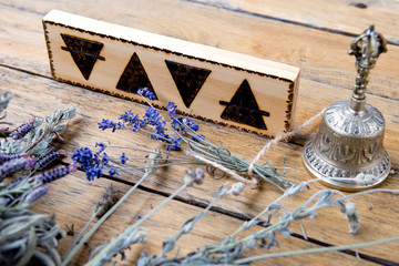 The Elements - Earth, Fire, Water, Air with brass bell and bundles of dried herbs