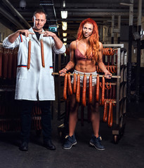 Funny butcher and his sexy girl assistant in the storage room.