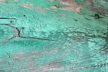 Old wooden texture with peeling paint. wooden background with remains of pieces of scraps of old paint on wood. Texture board with paint, vintage background peeling paint. old board with cracked 