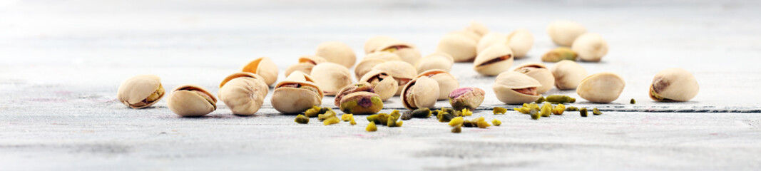 Pistachios, Roasted pistachio seeds in shells and shelled. Green, dried fruits, whole and chopped