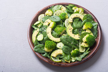 Green baby spinach salad with avocado