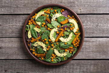 Baby spinach salad with sweet potato , chickpeas and avocado