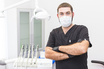 Fototapeta na wymiar Dental clinic. Reception, examination of the patient. Teeth care. Portrait of a dentist in a dental office
