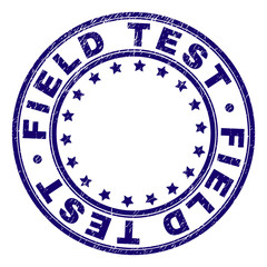 FIELD TEST stamp seal watermark with grunge texture. Designed with round shapes and stars. Blue vector rubber print of FIELD TEST label with grunge texture.