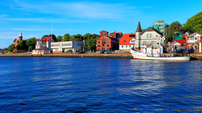 Ustka, Pomerania, Poland - Ustka seaport peers and ships and the Baltic Sea shoreline