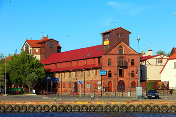 Ustka, Pomerania, Poland - Ustka seaport peers and ships and the Baltic Sea shoreline © Art Media Factory