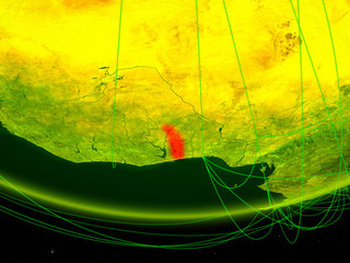 Togo on green model of planet Earth with network representing digital age, travel and communication.