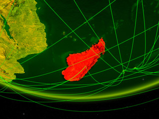 Madagascar on green model of planet Earth with network representing digital age, travel and communication.