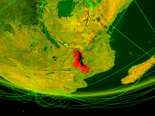 Malawi on green model of planet Earth with network representing digital age, travel and communication.