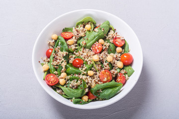 Spinach salad with quinoa , tomatoes and chickpea