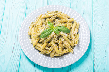 Italian penne pasta with sauce pesto