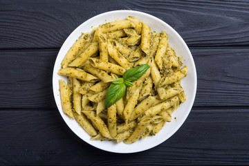 Italian penne pasta with sauce pesto
