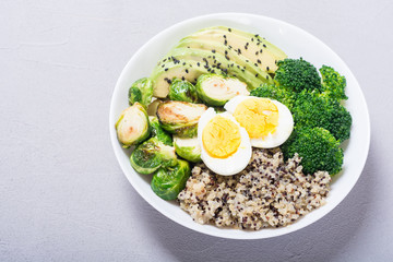 Buddha bowl with quinoa , eggs , avocado , brussels sprouts and broccoli